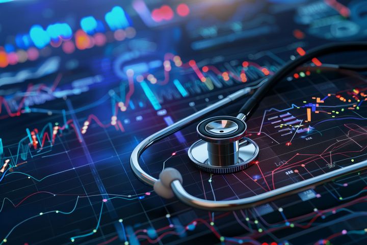 A stethoscope sits on data