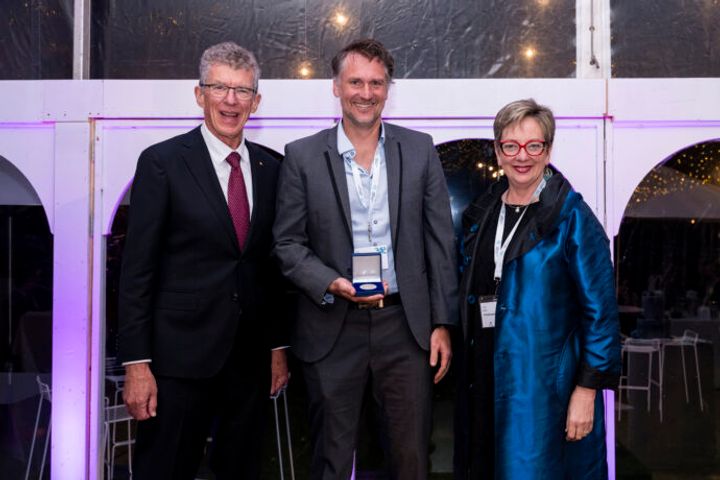 Professor James Hudson with the Jian Zhou Medal and Emeritus Professor Ian Frazer & AAHMS President Professor Louise Baur